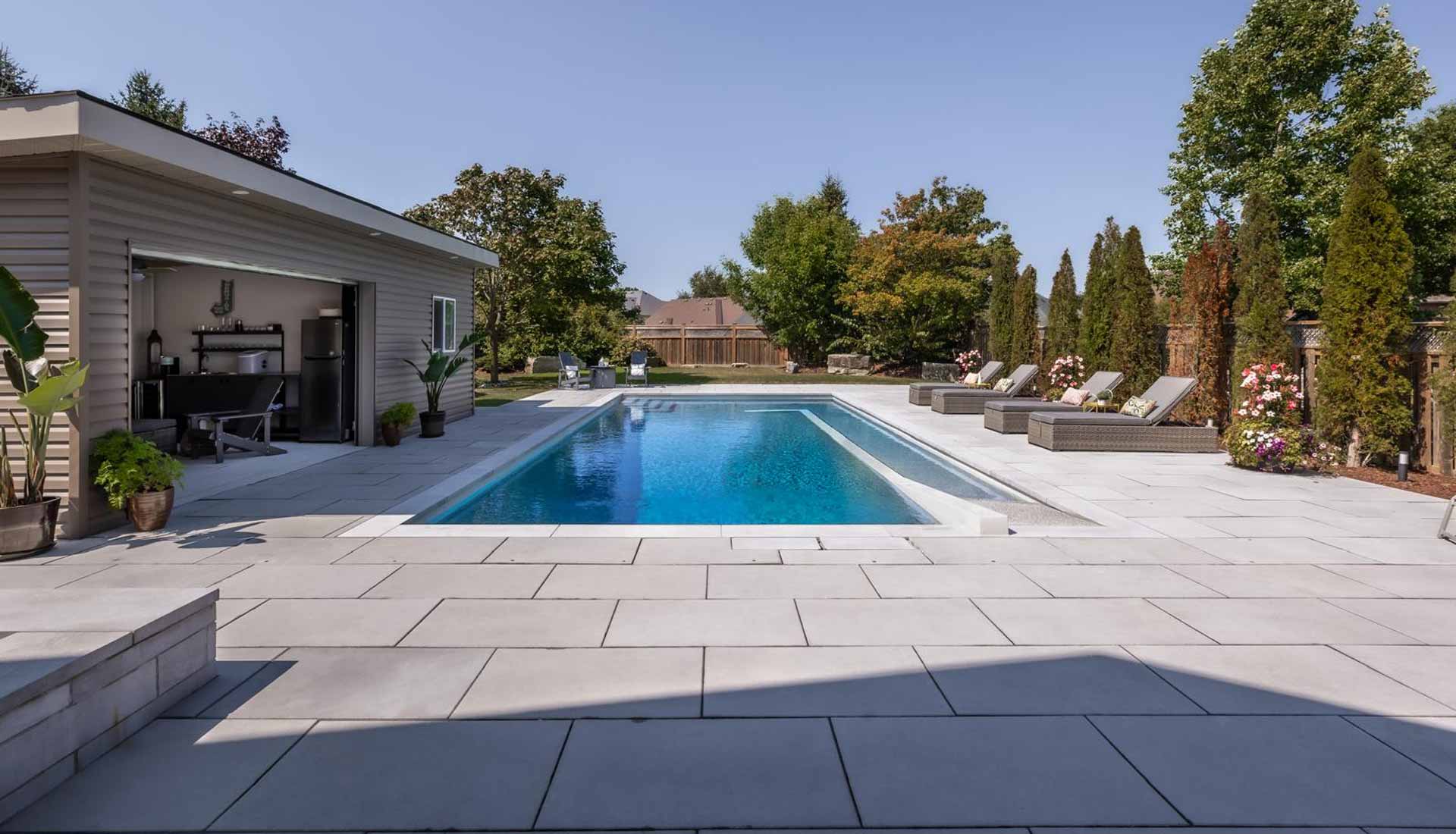Inground Pool with Cabana & interlock patio landscaping installation in Whitby, Ontario