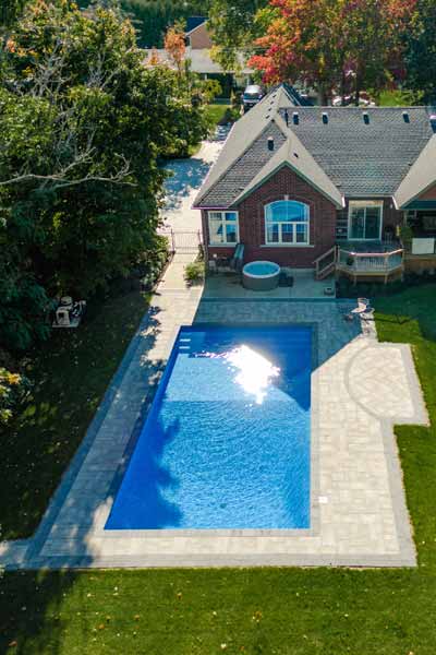 Inground Swimming Pool & Interlocking Stone Patio Landscaping & Hardscaping Project in Scarborough, Ontario
