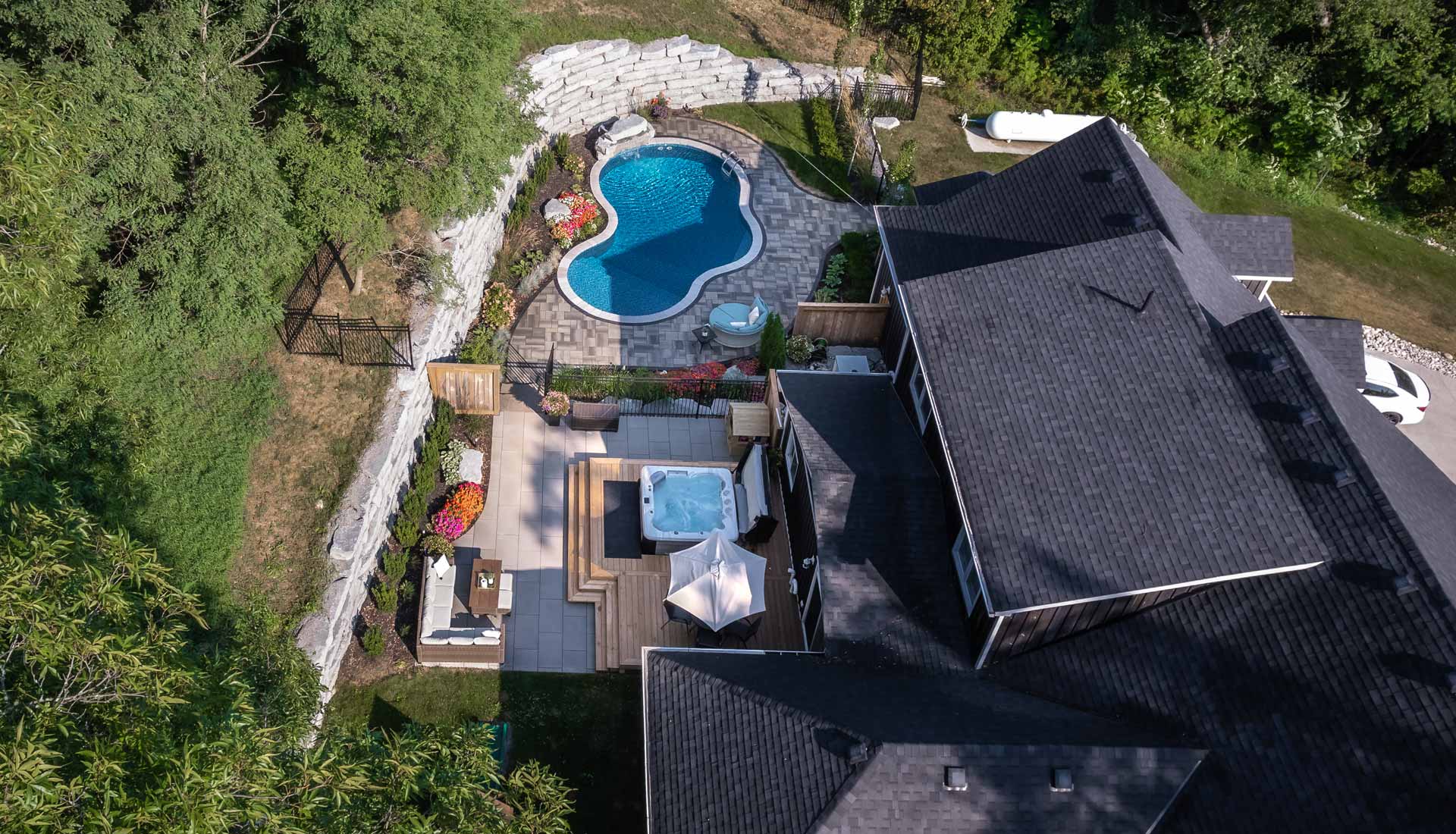 Interlock patio, pool, waterfall feature, retaining wall landscaping companies in Gores Landing & Rice Lake, Ontario